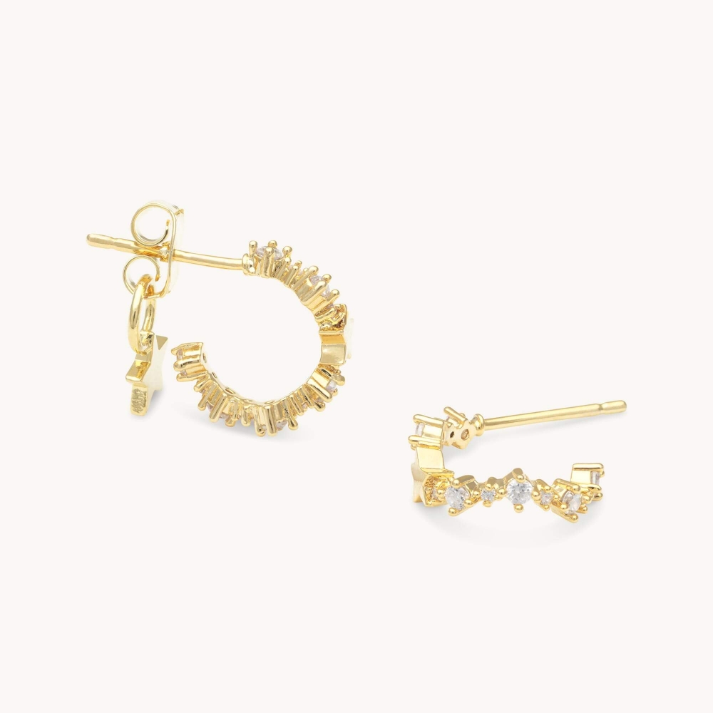 A new addition to the collection, our Petite Capella hoop earring is the perfect match to any look. Set in gold, these earrings bring attention with curved lines that are adorned with petite clear Swarovski crystals.