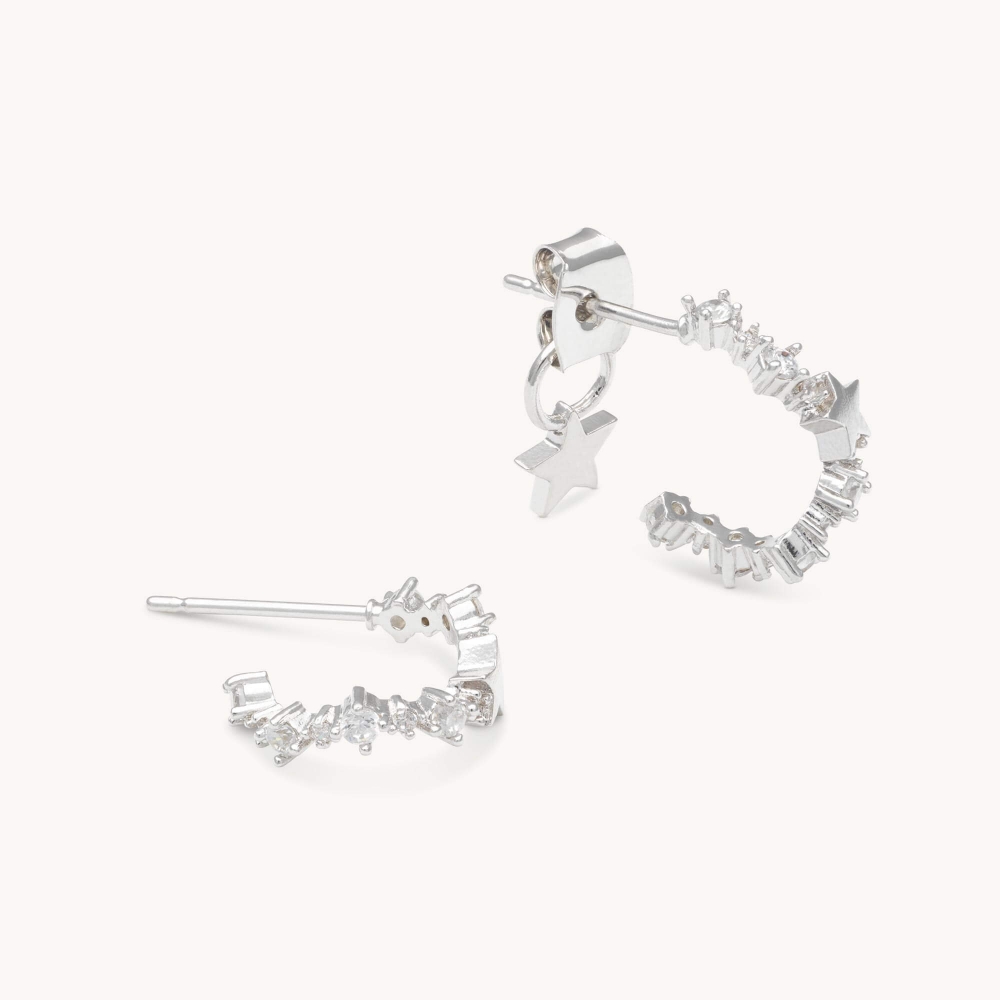 A new addition to the collection, our Petite Capella hoop earring is the perfect match to any look. Set in silver, these earrings bring attention with curved lines that are adorned with petite clear Swarovski crystals.